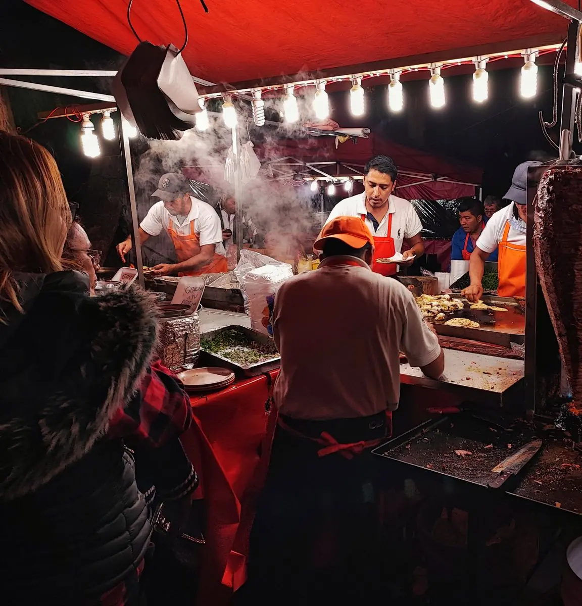 Busy taco grill at night